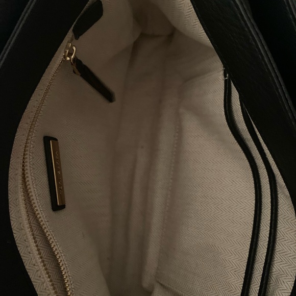 Tory Burch—100% leather. This bag has lots of room, three pockets. - Picture 8 of 10